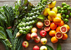 a group of fruits and vegetables on a wood surface Healthy Weight Loss Diets Old Trafford